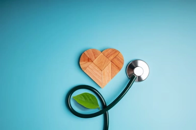 Stethoscope forming heart shape symbolizing AI-driven healthcare and revenue cycle optimization