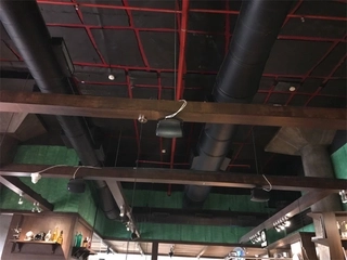 Open ceiling round duct system at Incognito Baner
