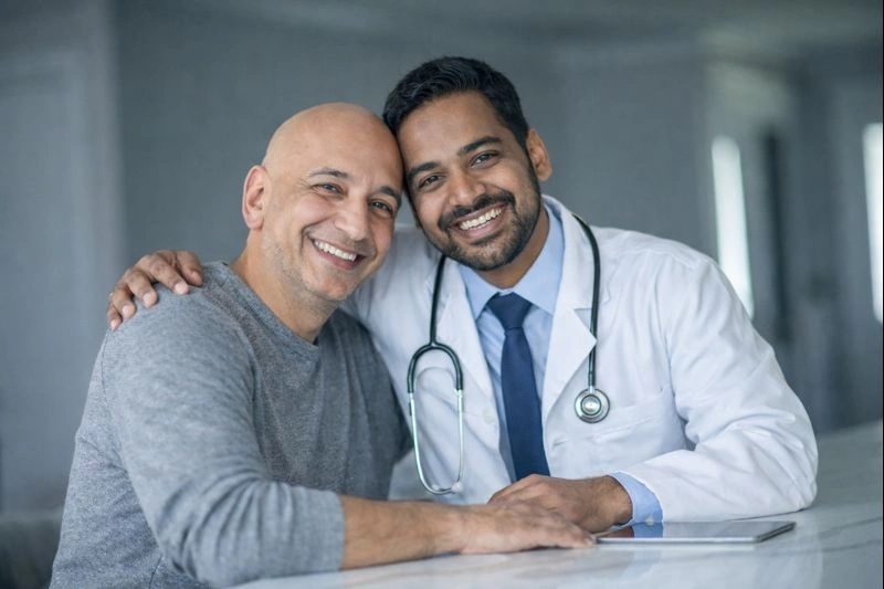 Doctor with patient checking X-ray